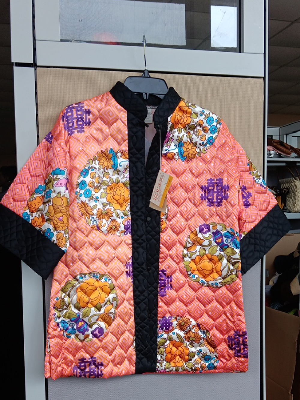 Women's Quilted Floral Puffer Jacket in Orange with Black Trim